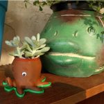 3d printed octopus planter holding a succulent